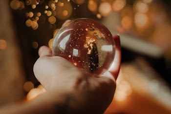 Person Holding Snow Globe