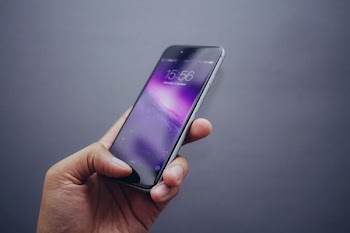 person holding space gray iPhone X