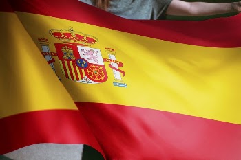 Person holding Spanish flag background, | Free Photo - rawpixel