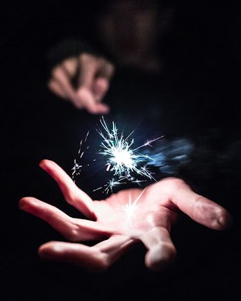 person holding sparkler