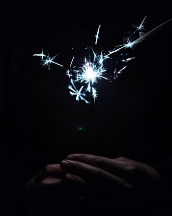 person holding sparkler