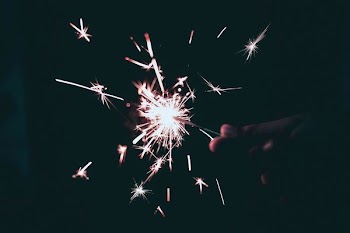 person holding sparkling light