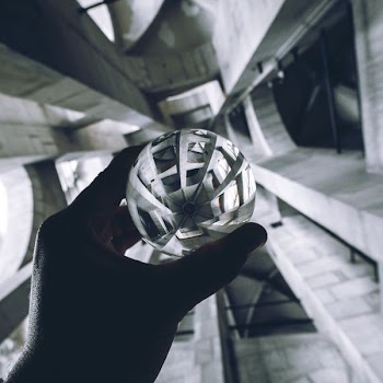 person holding sphere