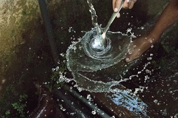 Person Holding Stainless Steel Spoon