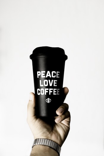 Person Holding Starbucks Coffee Tumbler