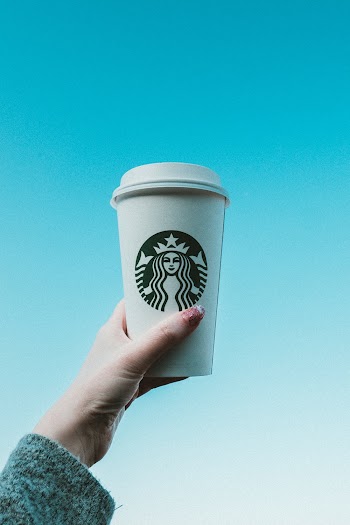 Person Holding Starbucks Tumblers
