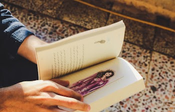 Person Holding Story Book
