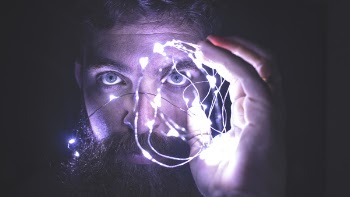 Person Holding String Lights Photo