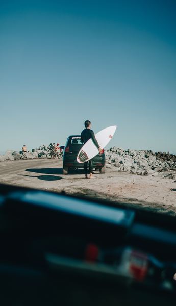 person holding surfboard outdoor