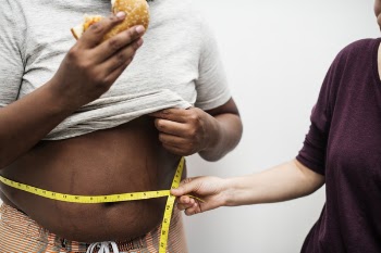 Person Holding Tape Measure