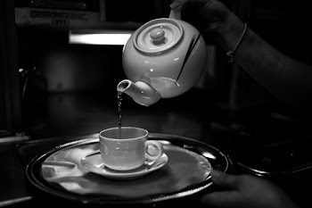 Person Holding Teapot