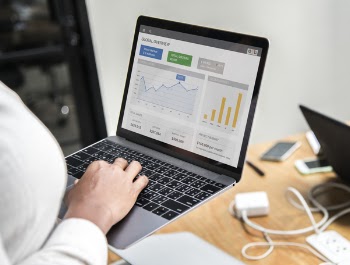 Person Holding Turned-on Laptop