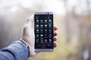 Person Holding Turned-on Smartphone