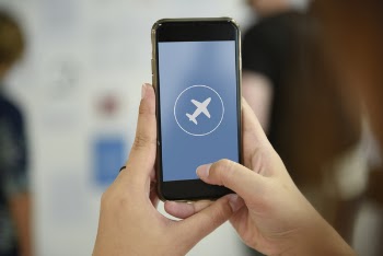 Person Holding Turned-on Space Gray Iphone 6