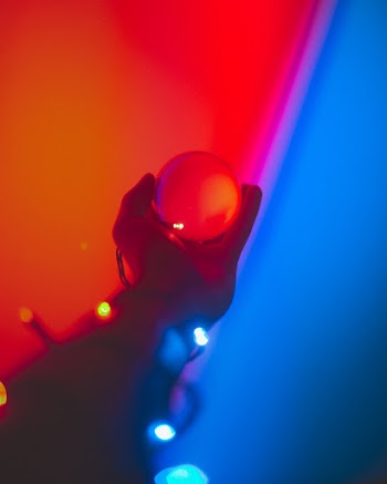 Person Holding White Ball