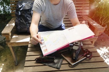 Person Holding White Book