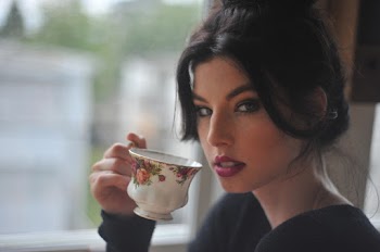 Person Holding White Ceramic Cup