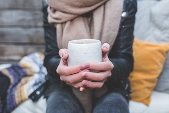 Person Holding White Ceramic Cup