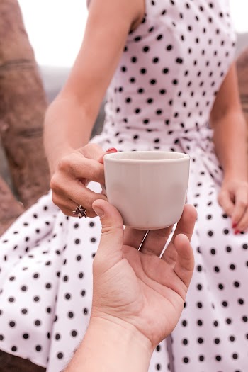 Person Holding White Ceramic Mug