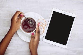 Person Holding White Ceramic Mug