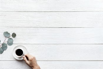 Person Holding White Ceramic Teacup With Black Coffee