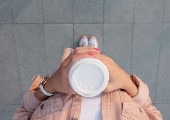 Person Holding White Disposable Cup