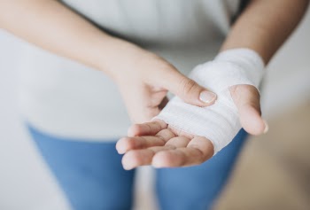 Person Holding White Hand Wrap