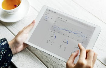 Person Holding White Ipad