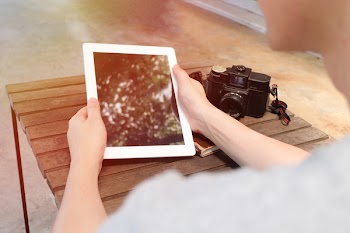 Person Holding White Ipad