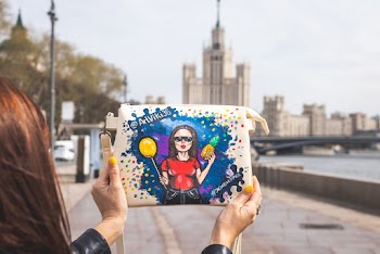 Person Holding White Leather Sling Bag