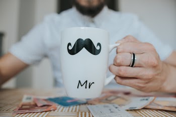 Person Holding White Mr. Ceramic Mug