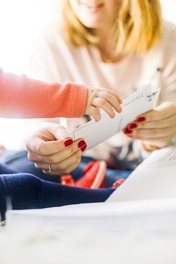 Person Holding White Printer Paper