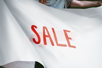 Person holding white sale flag | Free Photo - rawpixel