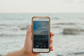 Person Holding White Samsung Android Smartphone