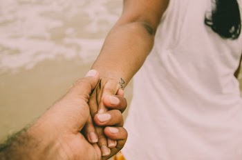 Person Holding Woman's Hand