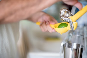Person Holding Yellow Plastic Ornament
