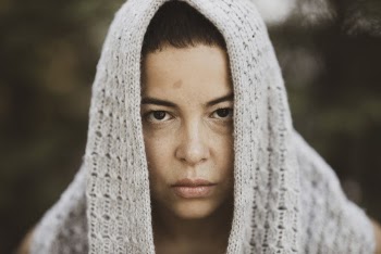 Person in a Gray Knitted Hoodie