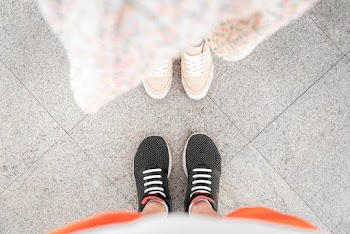 Person in Black and White Striped Socks