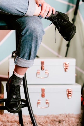 Person in Black Leather Shoes and Blue Jeans