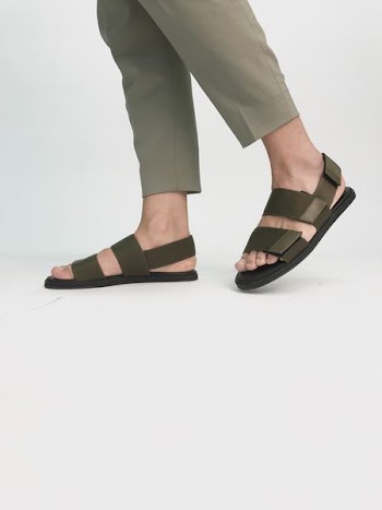 person in black velcro sandals