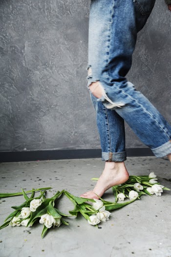 Person in Blue Ripped Jeans
