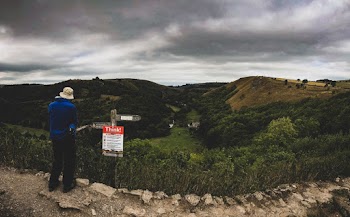 Person in Blue Top Staring At Hills