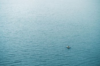 person in boat sailing at daytime