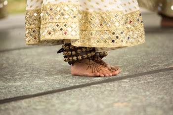 person in brown ankle bracelet