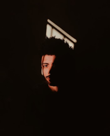 Person in Dark Room