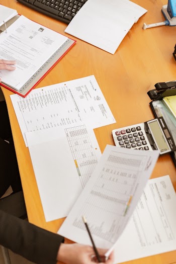 Person in Front of Paper Works
