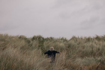 person in grass