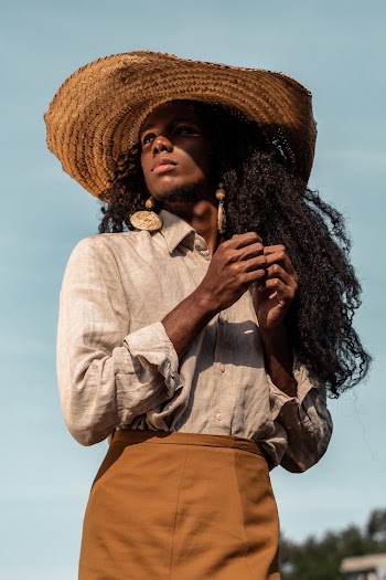 Person In Long Sleeved Shirt And Brown Skirt