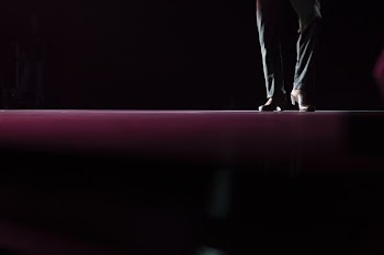 person in pair of brown leather formal shoes and black jeans