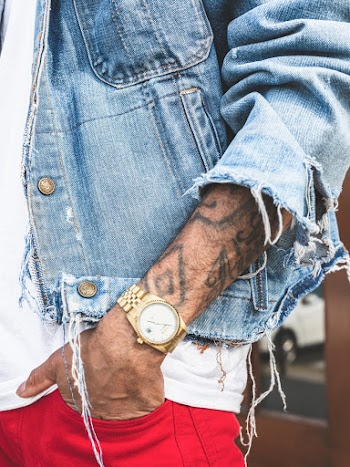 Person in Round Gold-colored Watch